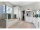 Bathroom featuring shower, soaking tub, double vanity, and tiled floors at 739 Spring Island Way, Orlando, FL 32828