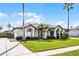 Charming single-story home featuring well-manicured landscaping, a neutral color palette, and arched entryway at 739 Spring Island Way, Orlando, FL 32828