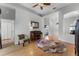 Inviting living room with wood floors, a piano, colorful rug, and ample natural light at 739 Spring Island Way, Orlando, FL 32828