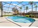 Sparkling screened pool with water feature provides a refreshing outdoor oasis for relaxation and recreation at 739 Spring Island Way, Orlando, FL 32828