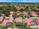 The home features a screened-in pool and is nestled among lush greenery in a vibrant community at 8012 S Madeira Ct, Orlando, FL 32836