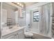 Bathroom with subway tile shower and single sink vanity at 8012 S Madeira Ct, Orlando, FL 32836