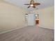 Neutral bedroom featuring a ceiling fan, with an ensuite bathroom for convenience and privacy at 8323 Bella Vida Cir, Davenport, FL 33896