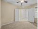 Spacious bedroom showcasing an open doorway to the hallway and closet at 8323 Bella Vida Cir, Davenport, FL 33896