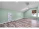 Spacious bedroom with hardwood floors and a large window providing natural light at 8712 Irmastone Way, Orlando, FL 32817