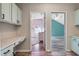 Bright hallway features built-in cabinetry with views into bedrooms, enhancing the home's spaciousness at 8712 Irmastone Way, Orlando, FL 32817