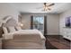 A cozy and spacious main bedroom with a light color palette, offering a bright and relaxing ambiance at 8712 Irmastone Way, Orlando, FL 32817