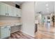 Hallway has built-in cabinetry with views into bedrooms, enhancing the home's spaciousness at 8712 Irmastone Way, Orlando, FL 32817