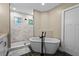 Stylish bathroom with freestanding tub and glass-enclosed shower at 909 E Central Blvd, Orlando, FL 32801