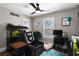 A bedroom features a black leather recliner, a desk, and is decorated with sports memorabilia at 909 E Central Blvd, Orlando, FL 32801