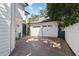 Spacious two-car garage with brick-paved driveway providing ample parking, adding to the home's curb appeal at 909 E Central Blvd, Orlando, FL 32801