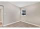 Bedroom with neutral walls and tile floors, featuring a window for natural light at 913 Ferndell Rd, Orlando, FL 32808