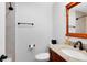 Bathroom with a granite countertop, framed mirror, and bronze fixtures at 922 Puma Trl, Winter Springs, FL 32708