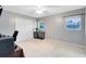 Neutral bedroom featuring carpet, windows, closet, ceiling fan and decor at 922 Puma Trl, Winter Springs, FL 32708