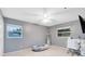 Neutral bedroom with carpet, windows, closet, ceiling fan, workspace, and decor at 922 Puma Trl, Winter Springs, FL 32708