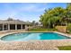 Inviting backyard pool with brick patio, perfect for relaxation and entertaining at 922 Puma Trl, Winter Springs, FL 32708