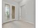 Bright foyer with decorative glass double doors and tiled flooring at 9235 San Jose Blvd, Howey In The Hills, FL 34737