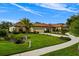 Beautiful single-story home with a well-manicured lawn and lush landscaping at 9235 San Jose Blvd, Howey In The Hills, FL 34737