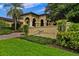 Inviting entrance to Marbella Spa with manicured landscaping and elegant signage at 9235 San Jose Blvd, Howey In The Hills, FL 34737