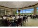 Restaurant dining area with views to the golf course, comfortable seating, and elegant decor at 9235 San Jose Blvd, Howey In The Hills, FL 34737