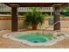 Inviting spa area with wooden pergola, mature potted palm, and spa rules sign at 9235 San Jose Blvd, Howey In The Hills, FL 34737