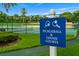 Community signage for pickleball and tennis courts surrounded by green grass at 9235 San Jose Blvd, Howey In The Hills, FL 34737