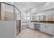 Bathroom featuring a shower with glass doors, a garden tub, and double sink vanity at 9834 Introduction Way, Orlando, FL 32832