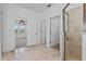 Bright bathroom features tile floors, glass enclosed shower, and access to the bedroom at 9834 Introduction Way, Orlando, FL 32832