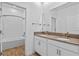 Bathroom with double sinks, framed mirrors, and a shower-tub combination with white tile at 9834 Introduction Way, Orlando, FL 32832