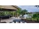 Outdoor grilling area with seating available, overlooking the lake at 1029 S Hiawassee Rd # 2414, Orlando, FL 32835