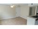 Neutral living area featuring tile flooring, a ceiling fan, and a front door at 1029 S Hiawassee Rd # 2414, Orlando, FL 32835