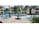 Community pool with plenty of seating and lounge chairs for residents and guests at 1029 S Hiawassee Rd # 2414, Orlando, FL 32835