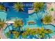 Captivating aerial view of a resort-style pool with palm trees, lounge seating, and a splash pad area at 10364 Ebb Tide Ln, Orlando, FL 32821