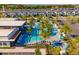 Aerial view of the community pool, palm trees, and lounge chairs, perfect for relaxation and fun at 10364 Ebb Tide Ln, Orlando, FL 32821