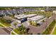 Stunning aerial view of community clubhouse, pool, lush landscaping, and convenient parking at 10364 Ebb Tide Ln, Orlando, FL 32821