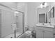 Bright bathroom with a glass-enclosed shower and modern fixtures at 10364 Ebb Tide Ln, Orlando, FL 32821