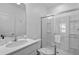 Bathroom featuring a shower, commode, vanity, and sink at 10364 Ebb Tide Ln, Orlando, FL 32821