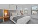 A large bed with white linens and gray accents at 10364 Ebb Tide Ln, Orlando, FL 32821