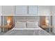 A bedroom with a bed, modern decor, a lamp, and gray accents at 10364 Ebb Tide Ln, Orlando, FL 32821