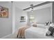 Bright bedroom with two beds, plush carpets, TV, and modern ceiling light fixtures for added ambiance at 10364 Ebb Tide Ln, Orlando, FL 32821