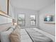 A bedroom with a bed, modern decor, and an exterior window at 10364 Ebb Tide Ln, Orlando, FL 32821