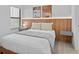 A bedroom with a bed, modern decor, a lamp, and a window at 10364 Ebb Tide Ln, Orlando, FL 32821