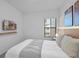 An interior bedroom with a tv, a bed, and an exterior window at 10364 Ebb Tide Ln, Orlando, FL 32821