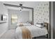 Charming bedroom featuring two twin beds, a Mickey Mouse wallpaper, and sleek black light fixtures at 10364 Ebb Tide Ln, Orlando, FL 32821