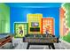 Fun game room with video games and a foosball table, perfect for entertainment at 10364 Ebb Tide Ln, Orlando, FL 32821