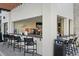Outdoor bar and lounge area with bar seating, providing a relaxing atmosphere with a TV at 10364 Ebb Tide Ln, Orlando, FL 32821