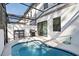 Inviting pool area with a grill and comfortable seating for outdoor relaxation at 10364 Ebb Tide Ln, Orlando, FL 32821