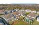 Aerial view of the community showing the house, the yard, and the surrounding homes and trees at 11464 Beau Repost Dr, Orlando, FL 32832