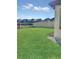 Beautiful backyard features lush green grass and a lake view with a black aluminum fence at 11464 Beau Repost Dr, Orlando, FL 32832