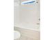 Bright, white bathroom with tub and tile surround at 11464 Beau Repost Dr, Orlando, FL 32832